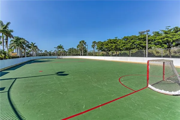 a view of a houses with palm trees
