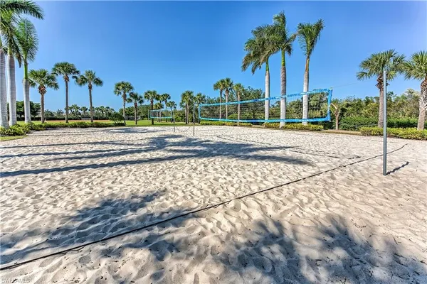 an aerial view of residential houses with outdoor space and swimming pool