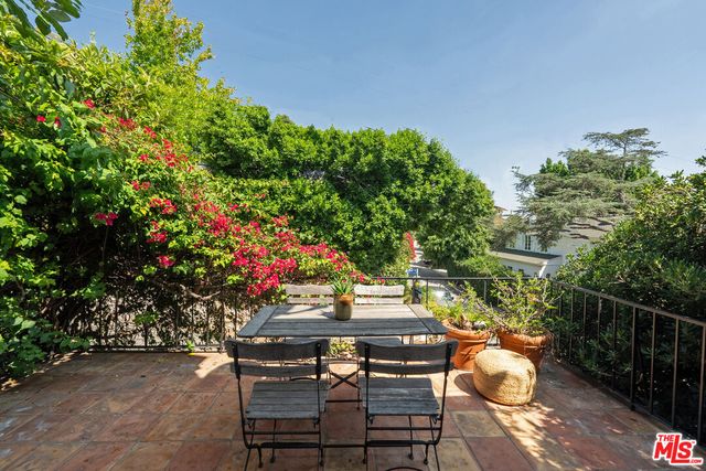 a spacious bathroom with a toilet sink and mirror