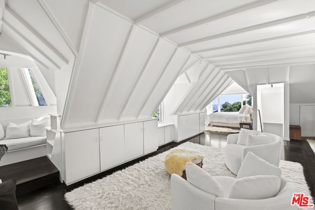 a living room with a couch and a large window