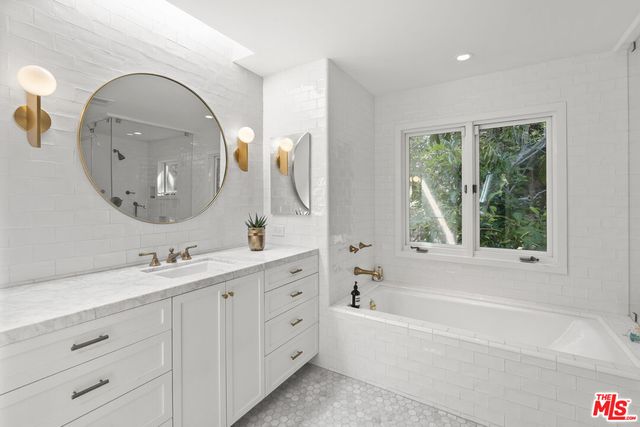 a living room filled with furniture and a large window