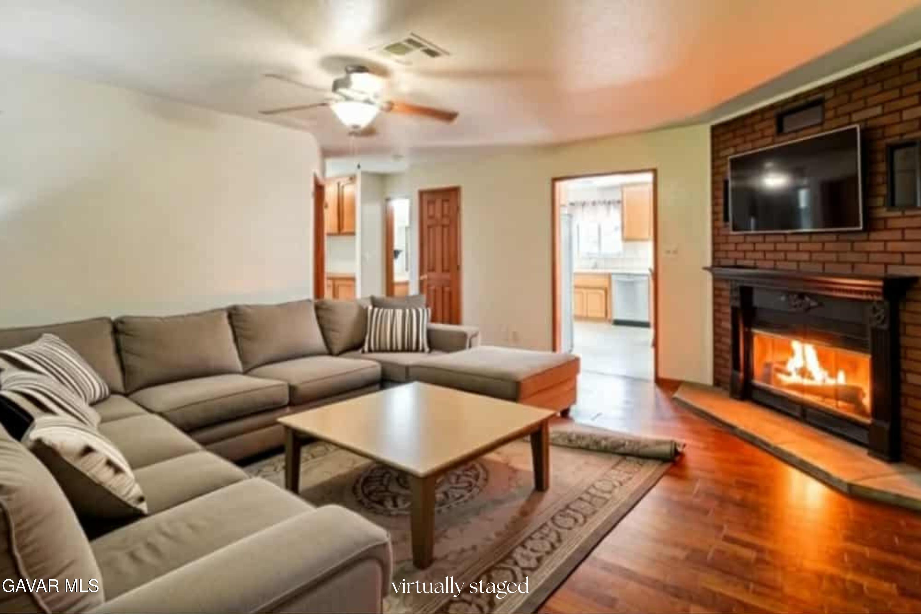 43230 Lookabout Road Lake Hughes, CA 93532 - Photo 2 of 35 a living room with furniture and a flat screen tv