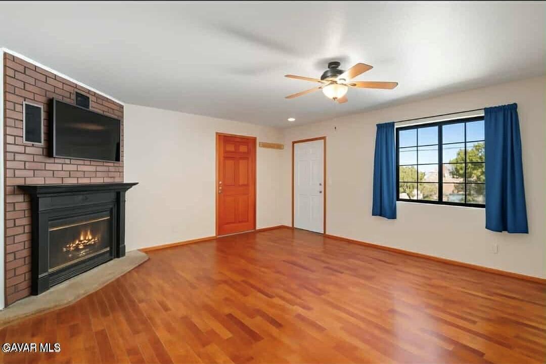 43230 Lookabout Road Lake Hughes, CA 93532 - Photo 5 of 35 a view of an empty room with window and fireplace