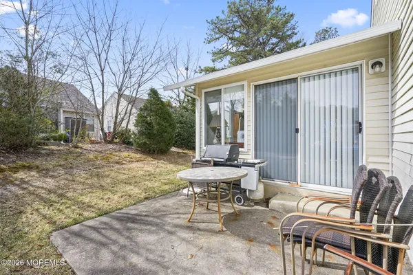 a view of a patio with a yard