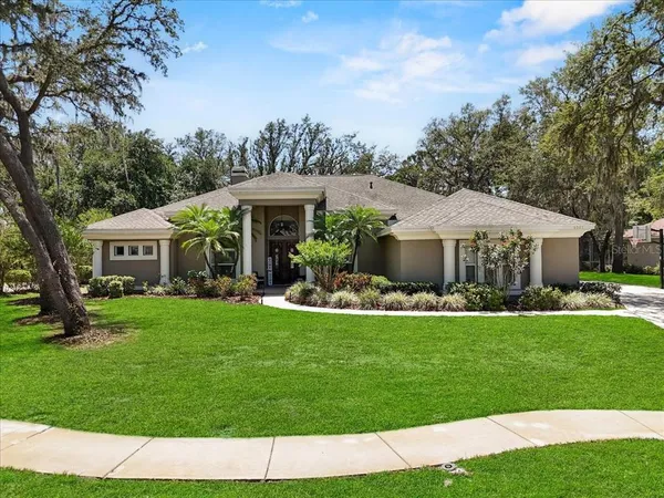 a front view of a house with a garden and porch