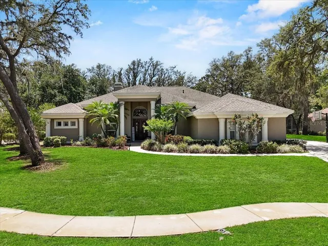 a front view of a house with a garden and porch