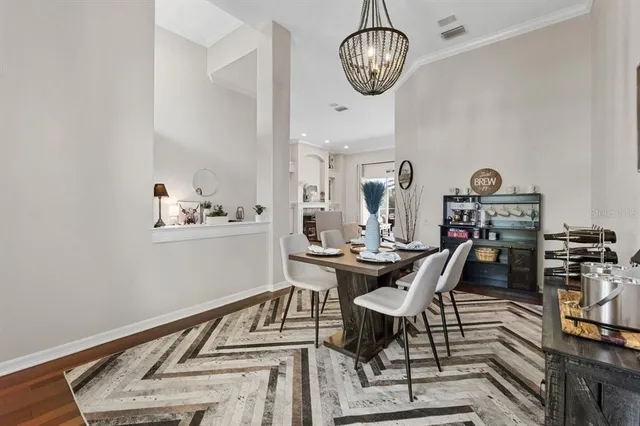 a living room with furniture a flat screen tv and a large window