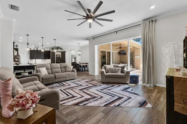a bedroom with furniture and a flat screen tv