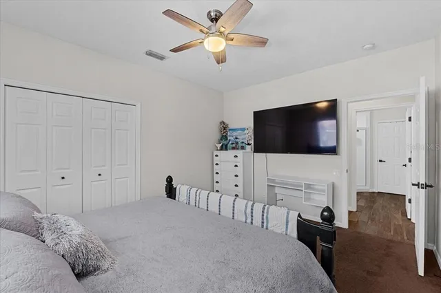 an aerial view of a house with a yard and garden