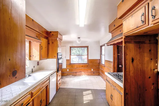 a spacious bathroom with a tub sink shower and mirror