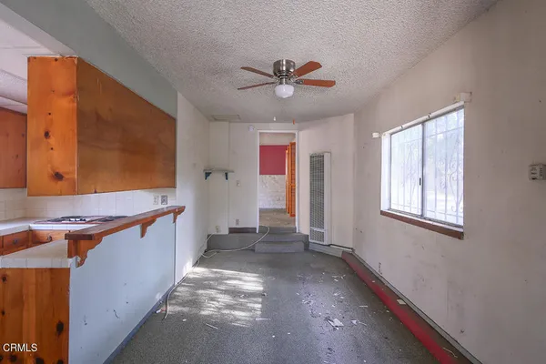a kitchen with stainless steel appliances granite countertop a sink and a stove