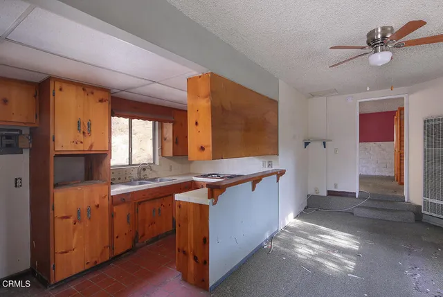 a living room with furniture and windows