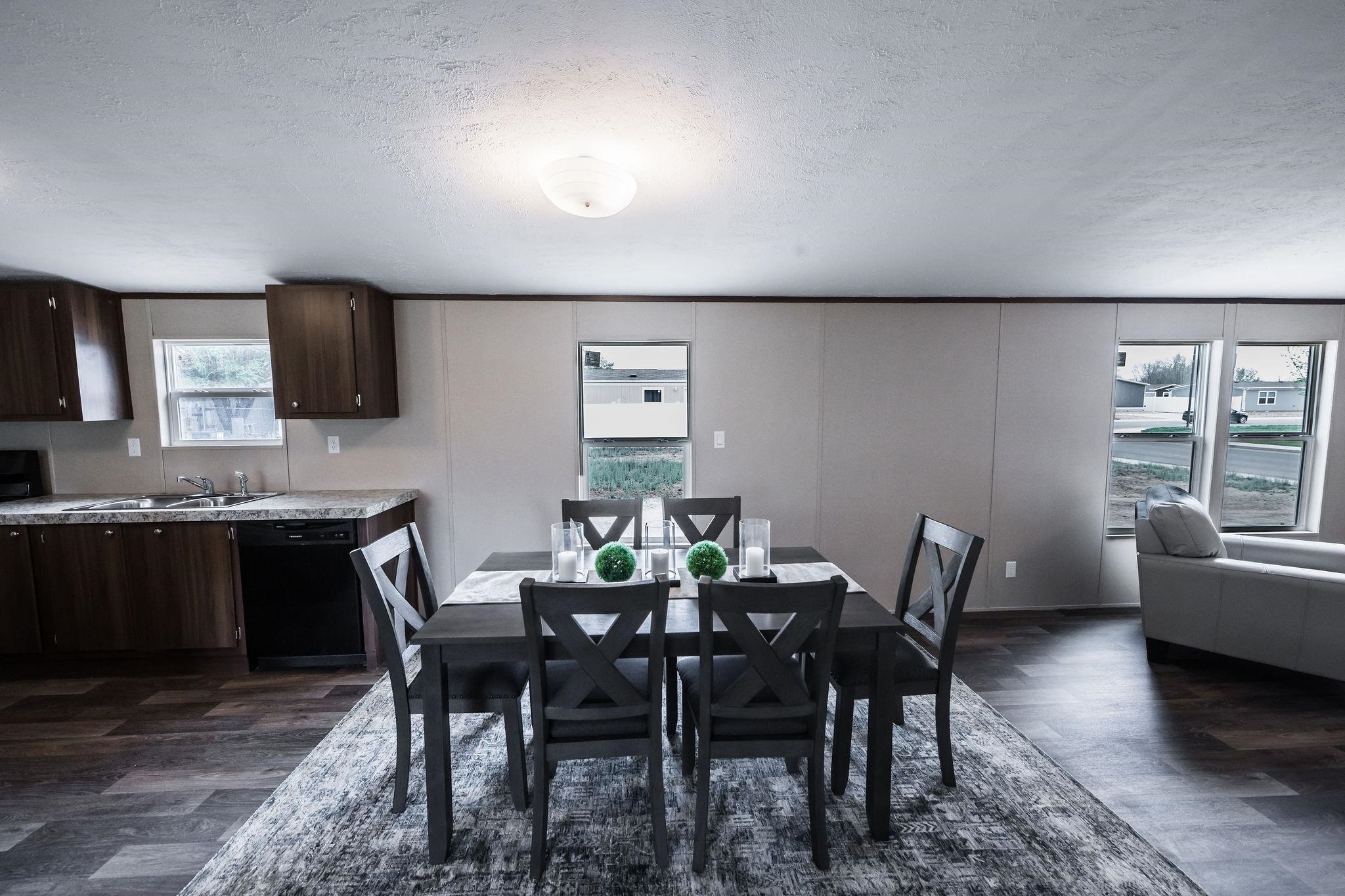 283 Clements Way Fruita, CO 81521 - Photo 8 of 16 a view of a dining room with furniture and wooden floor