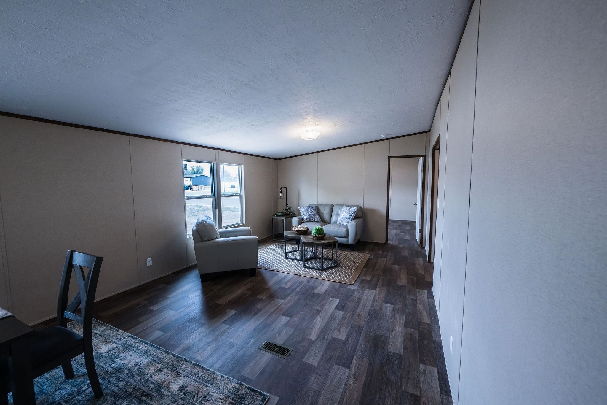 283 Clements Way Fruita, CO 81521 - Photo 9 of 16 a living room with furniture and a wooden floor
