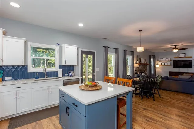a kitchen with a sink and cabinets