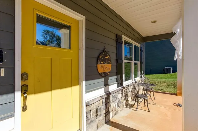 a view of an outdoor dining space with a patio
