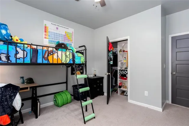 a room with furniture a rug and a window