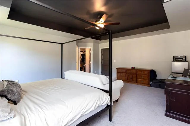 a bathroom with a bathtub shower sink and mirror