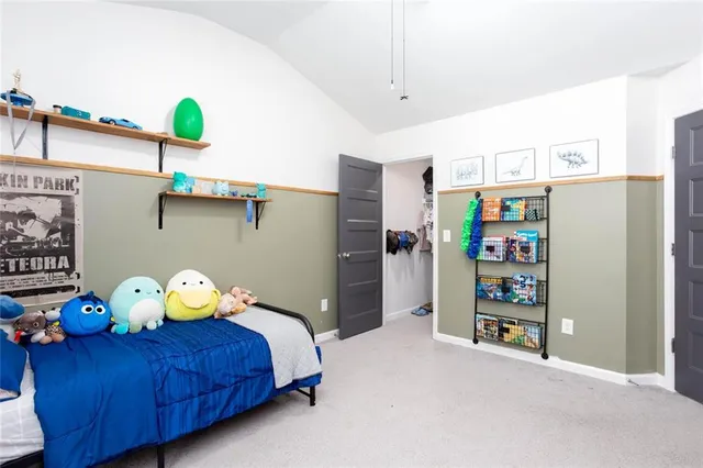 a bed room with a bed and a window