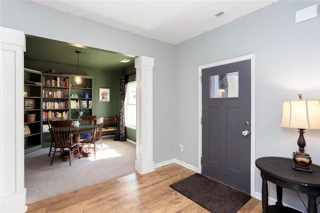 a view of a livingroom with furniture and workspace
