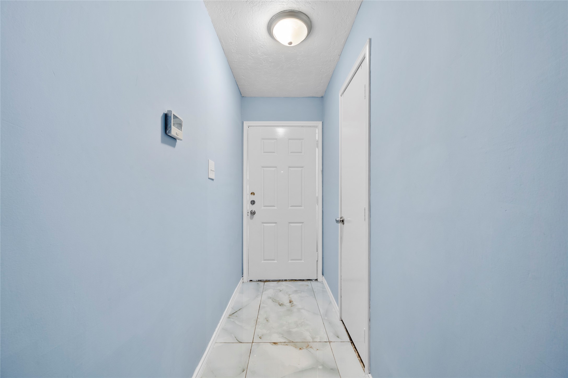 17006 Hall Shepperd Road Houston, TX 77049 - Photo 5 of 25 Entry, tile floor throughout