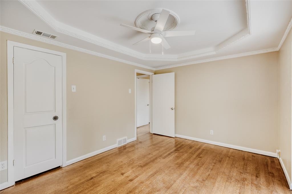 6612 East Mockingbird Lane Dallas, TX 75214 - Photo 15 of 28 a view of an empty room with wooden floor