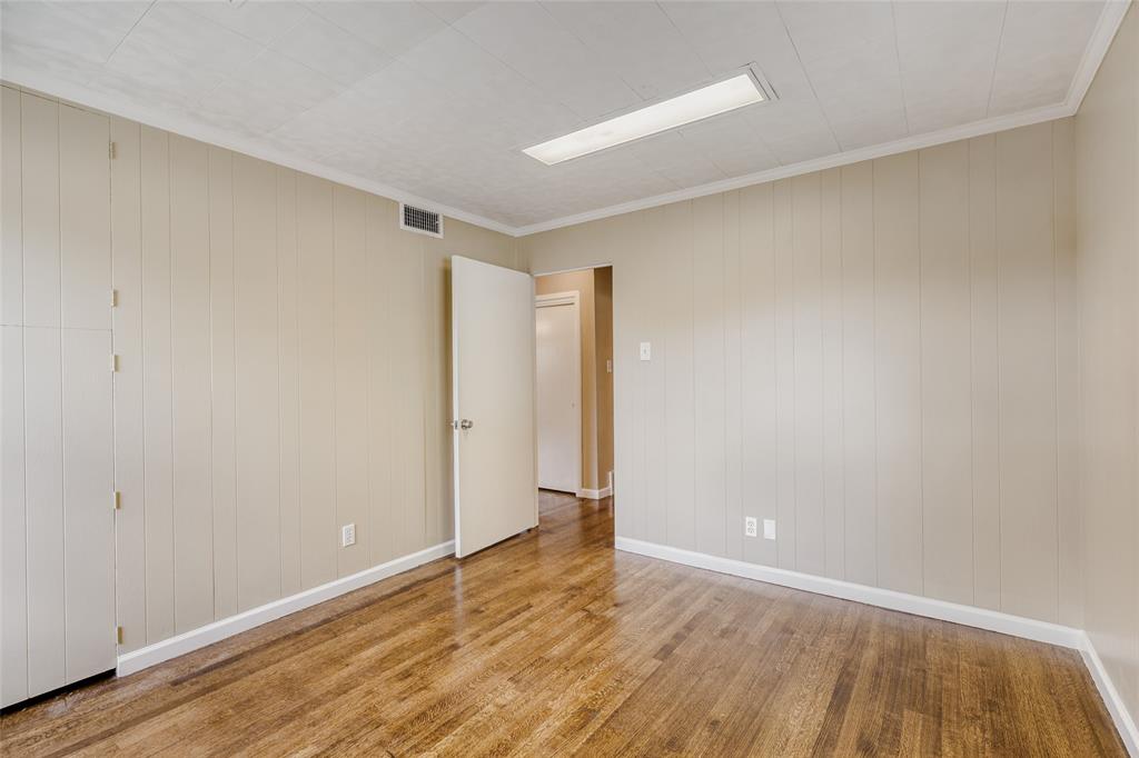 6612 East Mockingbird Lane Dallas, TX 75214 - Photo 18 of 28 a view of an empty room with wooden floor