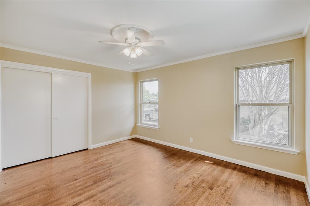 6612 East Mockingbird Lane Dallas, TX 75214 - Photo 20 of 28 a view of an empty room with wooden floor and a window
