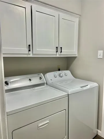 a bedroom with a bed and dresser