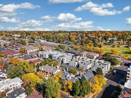 an aerial view of residential houses with outdoor space