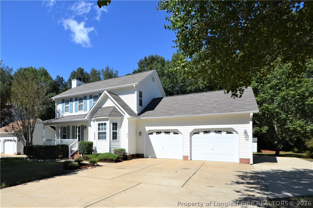 1404 Woodline Drive Raleigh, NC 27603 - Photo 1 of 35 a front view of a house with a yard