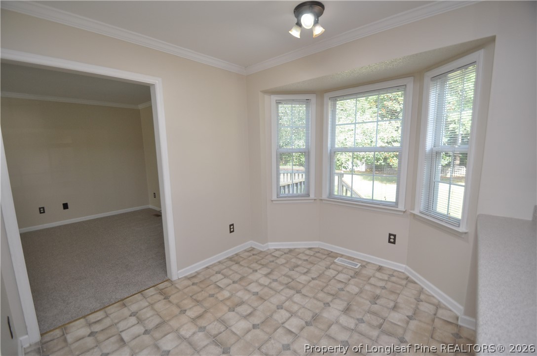 1404 Woodline Drive Raleigh, NC 27603 - Photo 14 of 35 a view of an empty room with a window