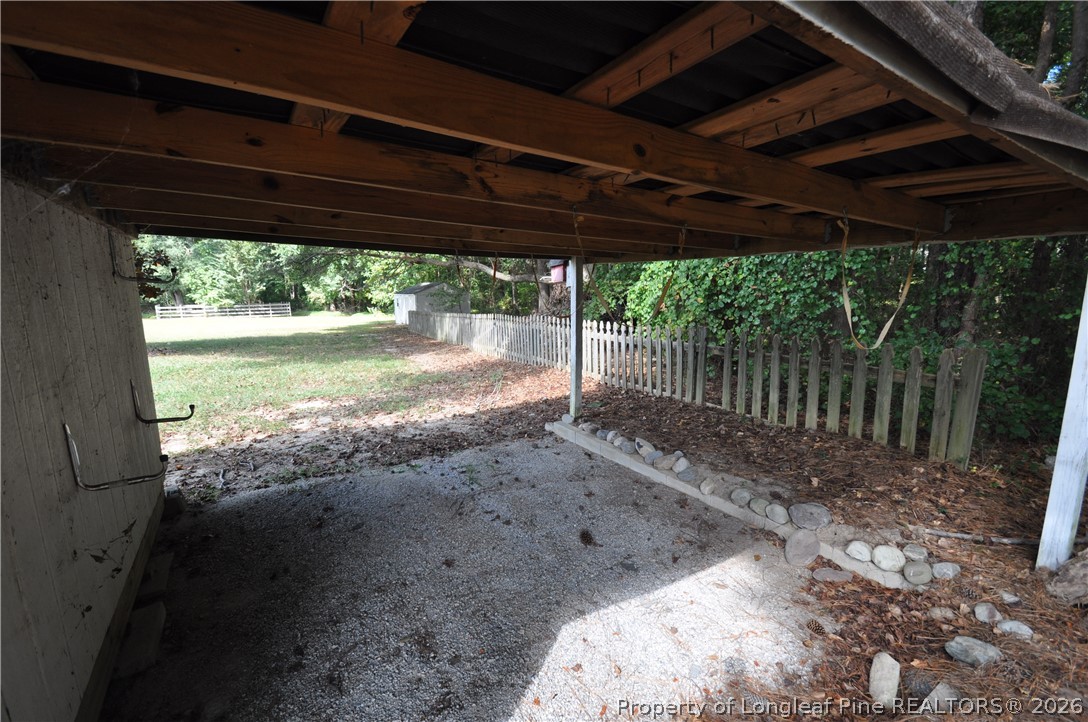1404 Woodline Drive Raleigh, NC 27603 - Photo 32 of 35 a backyard of a house with a garden and outdoor seating