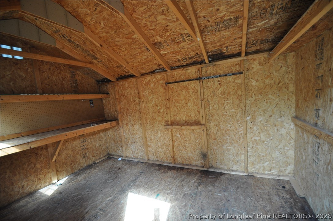 1404 Woodline Drive Raleigh, NC 27603 - Photo 33 of 35 a view of a room with wooden walls