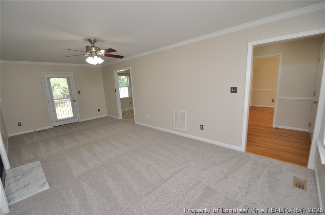 1404 Woodline Drive Raleigh, NC 27603 - Photo 5 of 35 a view of an empty room with a window