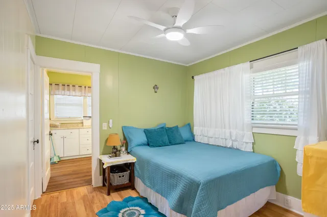 a bedroom with a bed and a window