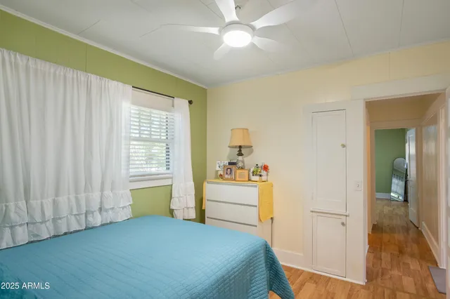 a bathroom with a sink and mirror with shower curtain