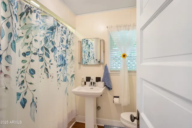 a view of room with window and wooden floor