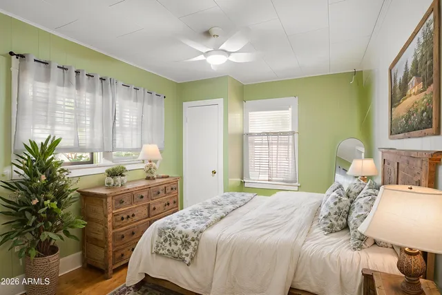 a view of wooden floor and windows in a room