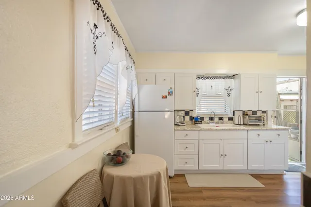 a kitchen with a stove and a refrigerator
