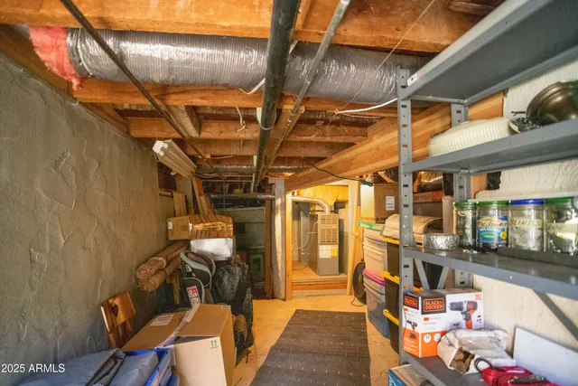 a view of a small house with yard and tree in the background