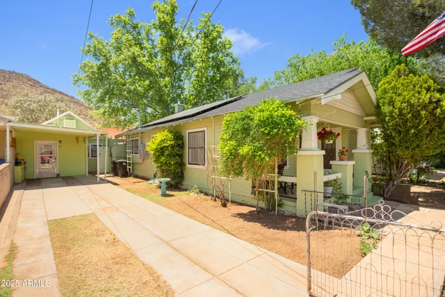 a front view of a house with a outdoor space