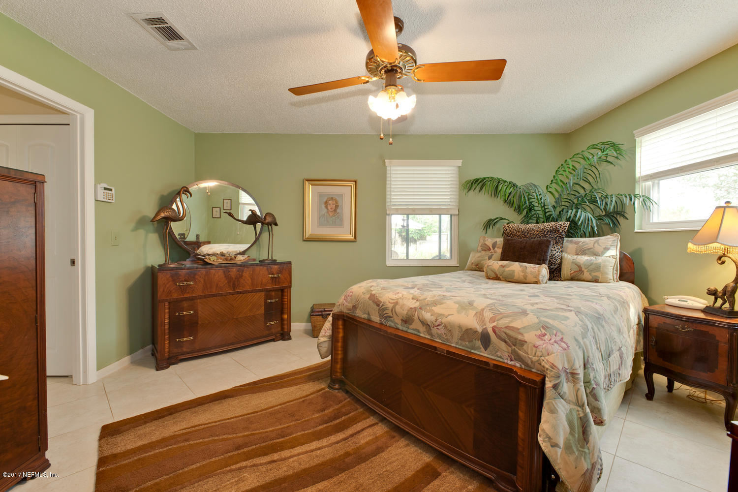 4 Amberjack Road Ponte Vedra Beach, FL 32082 - Photo 25 of 32 a bedroom with a bed and wooden floor