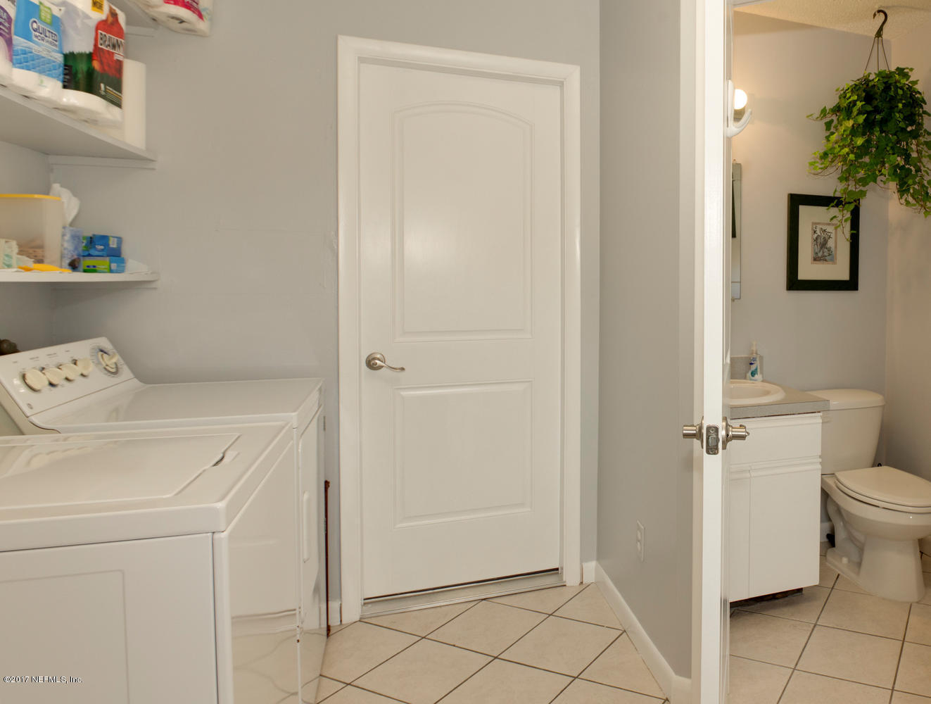 4 Amberjack Road Ponte Vedra Beach, FL 32082 - Photo 28 of 32 a utility room with cabinets washer and dryer