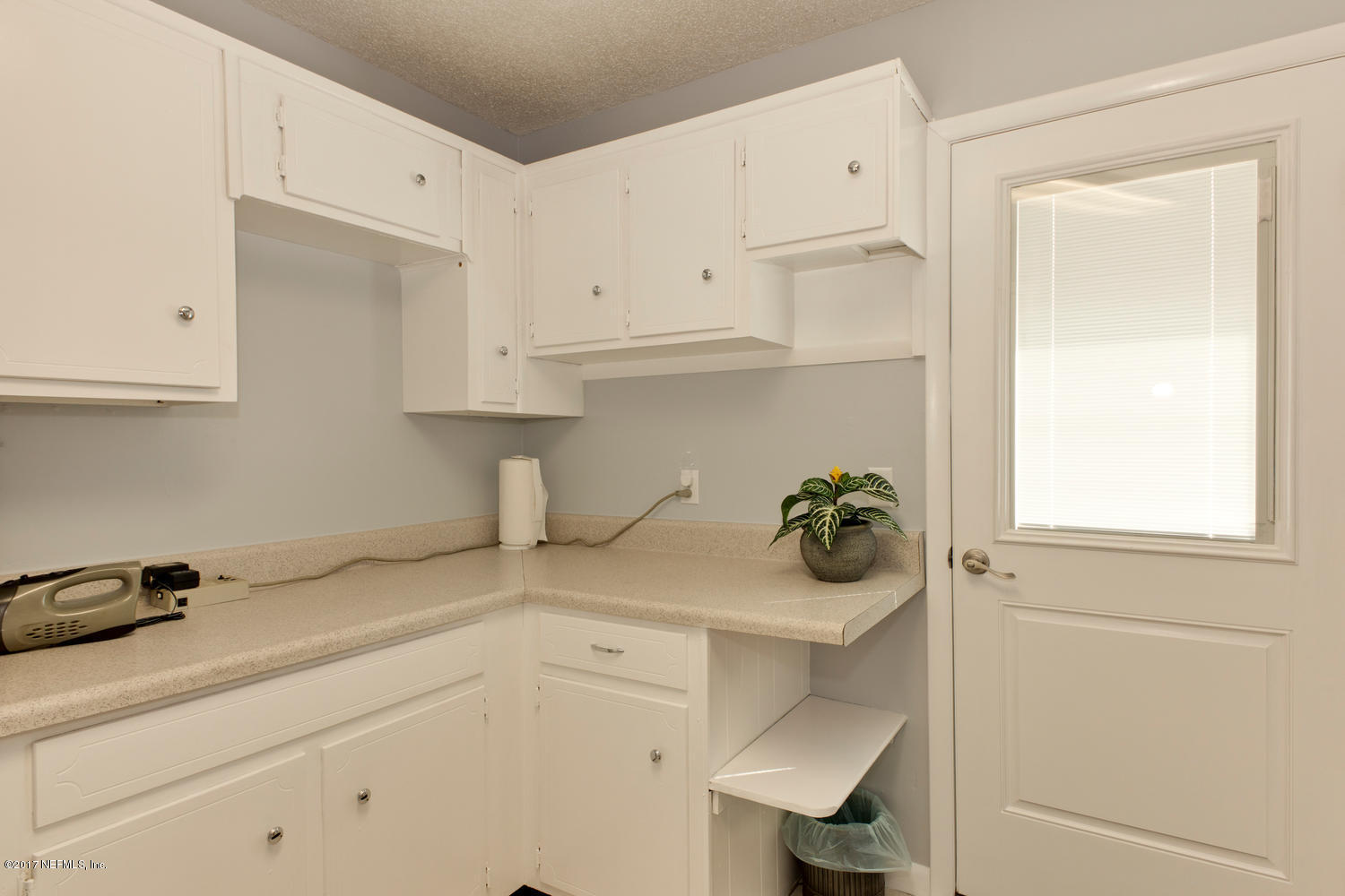 4 Amberjack Road Ponte Vedra Beach, FL 32082 - Photo 29 of 32 a kitchen with a refrigerator and window