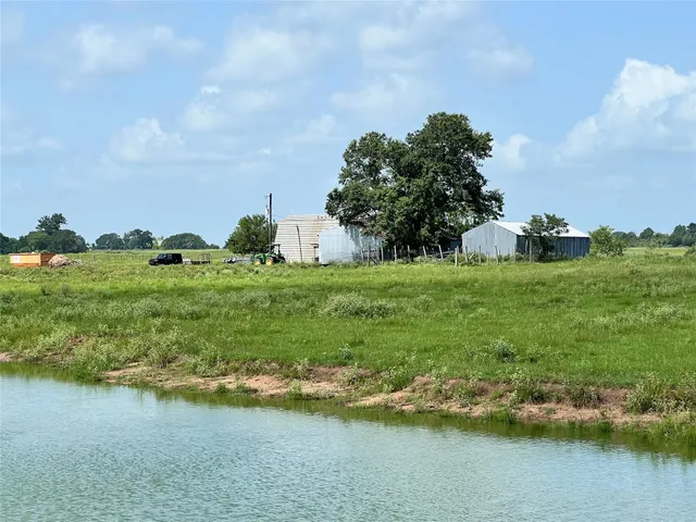 a view of a lake and sunset
