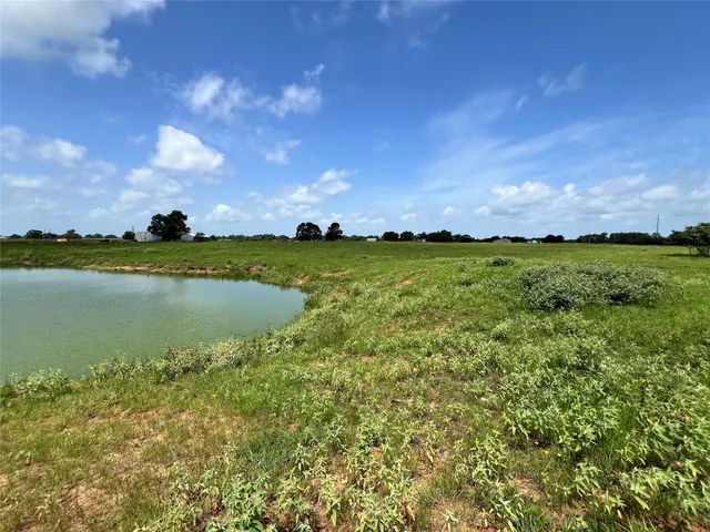 a view of a lake and yard