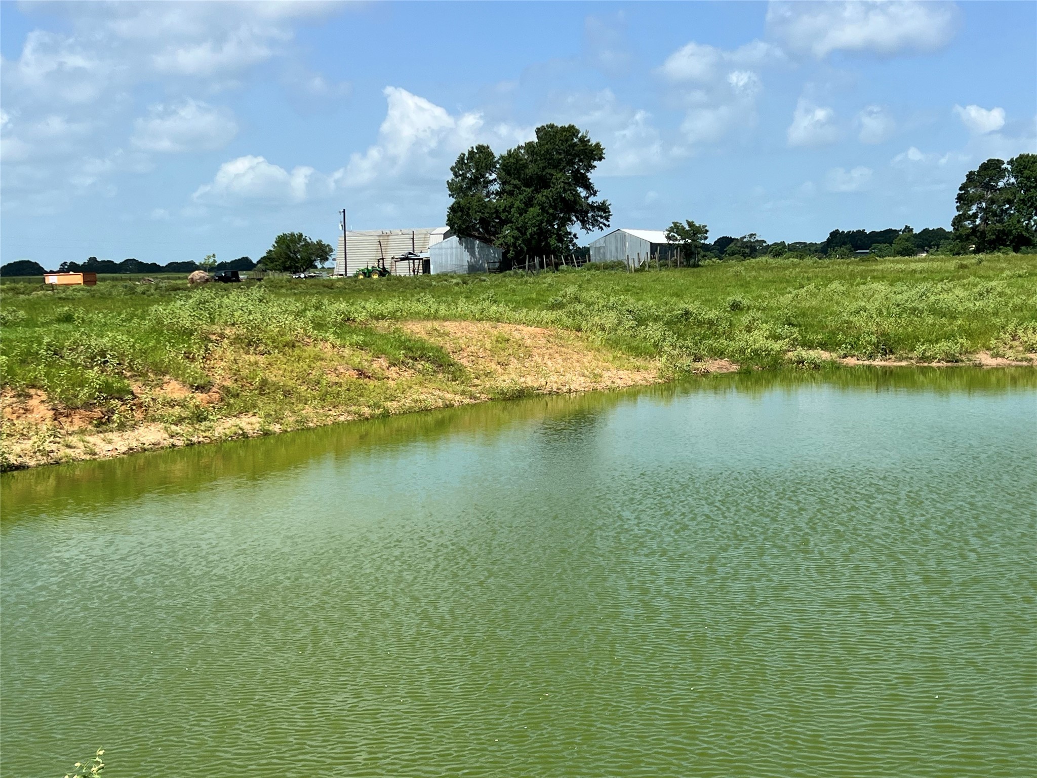 20573 Fontenot Lane Hempstead, TX 77445 - Photo 15 of 36 a view of a lake with houses in the back