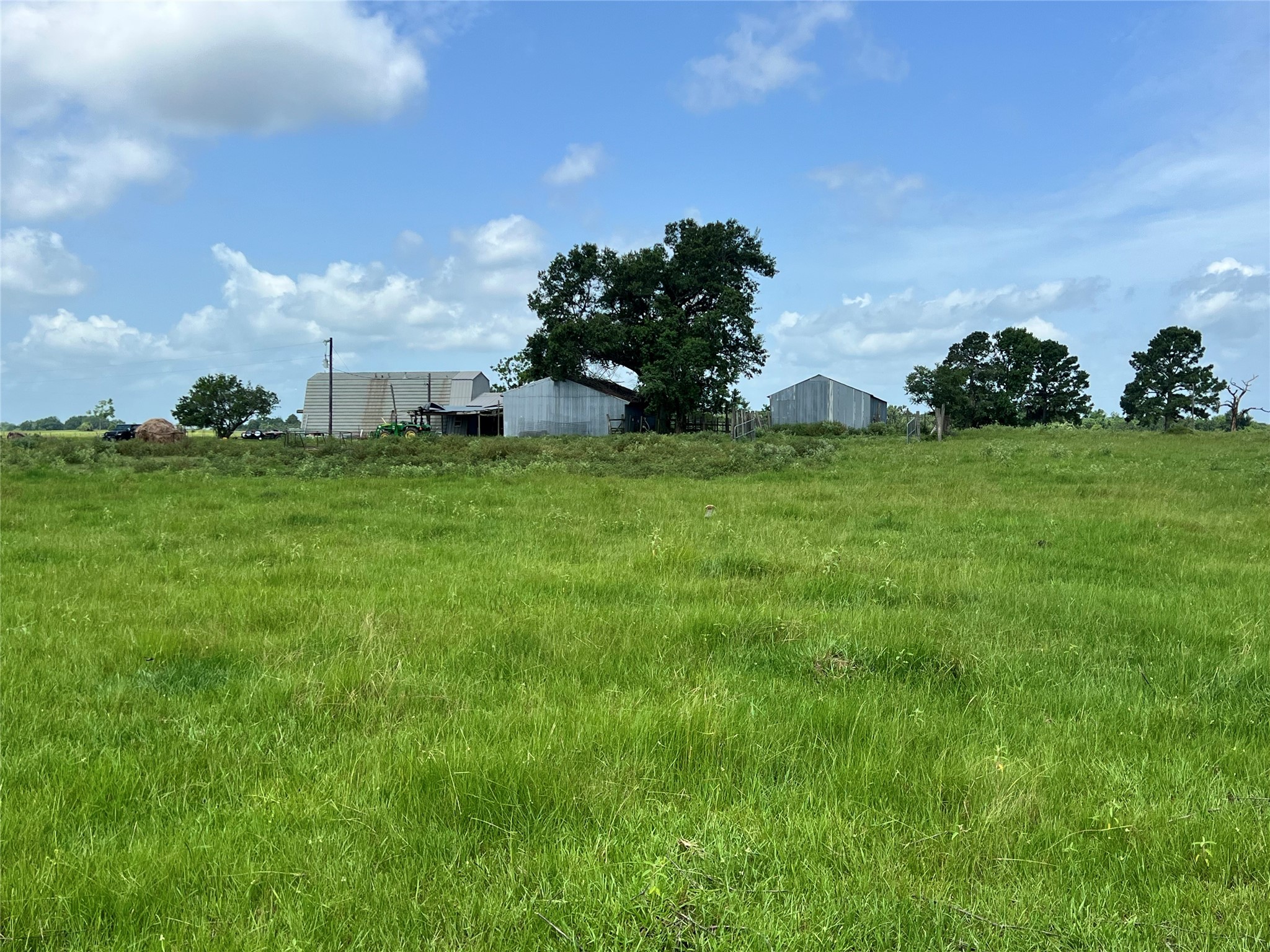20573 Fontenot Lane Hempstead, TX 77445 - Photo 20 of 36 a backyard of a house with lots of green space and lake view