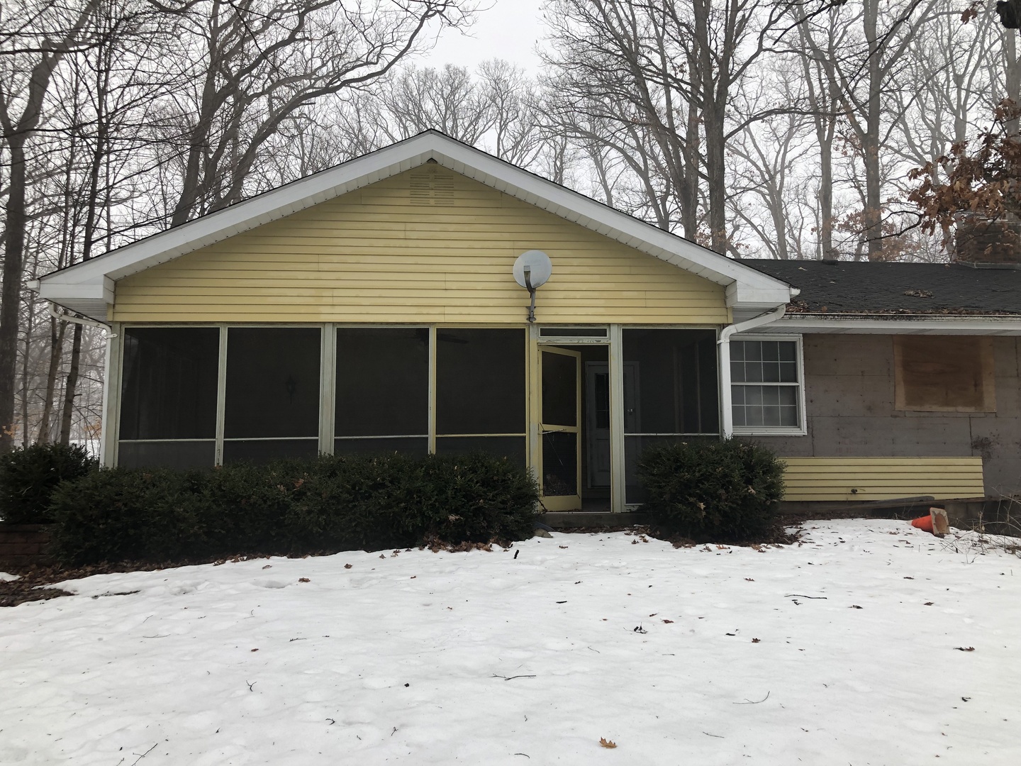 11636 Deerpath Road Sycamore, IL 60178 - Photo 2 of 5 a front view of a house with a yard covered in snow